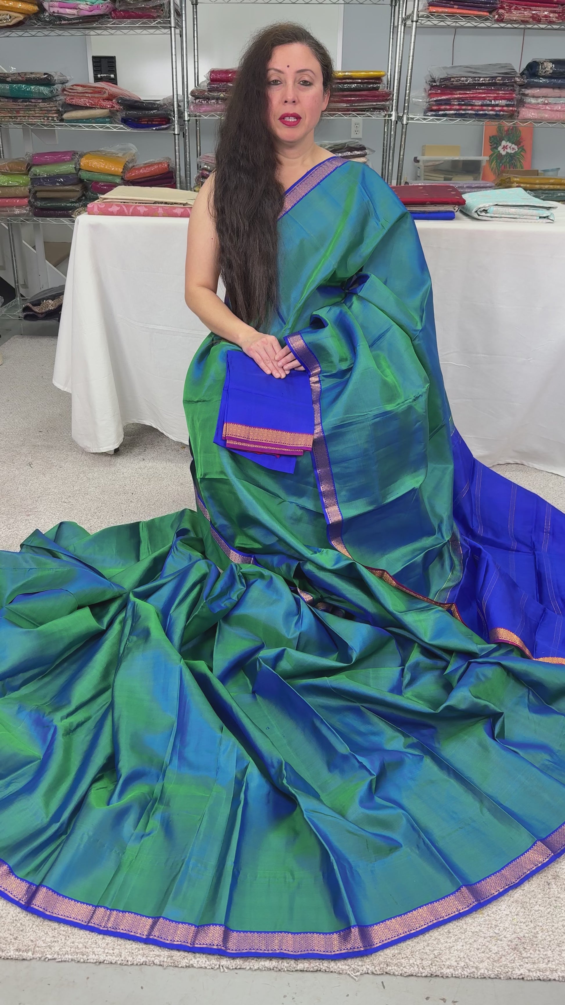 Video of Peacock Green and Blue Kanjivaram Silk Saree with Small Gold Border.