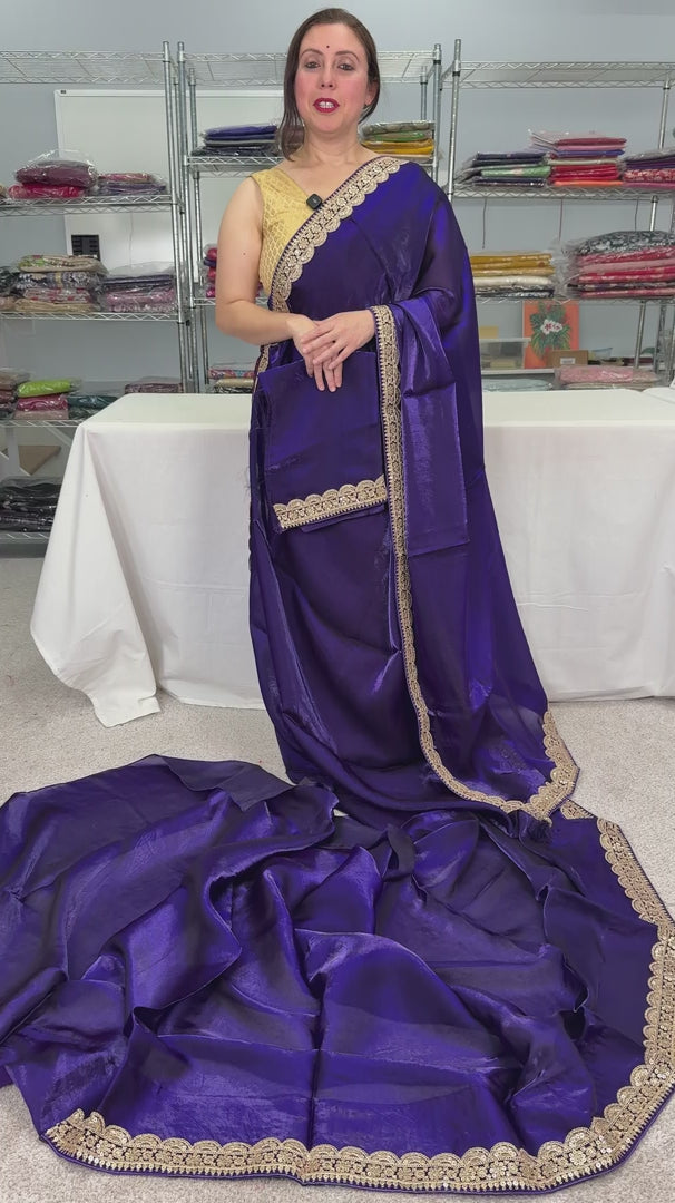 video of product Nadia - Designer Glass Tissue Purple Partywear Saree with Patched Golden Border from Saree Mandi saree store.