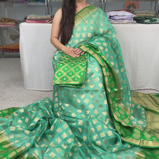 Video of Silk Mark Certified Kora Silk Banarasi Saree in Light Blue, Green and Gold.
