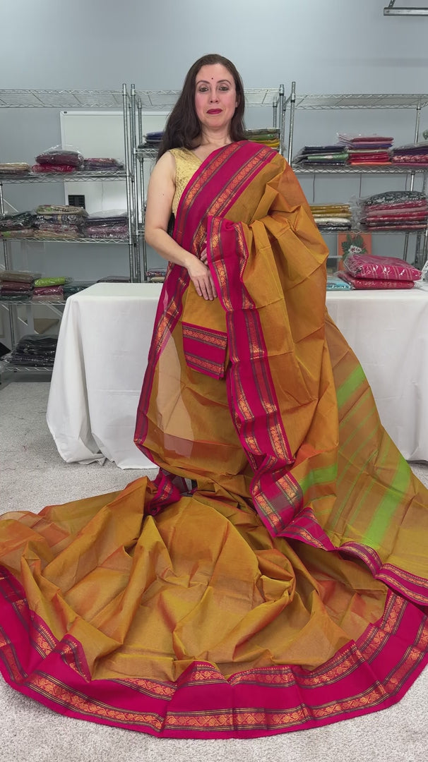 video of product Vrinda - Handwoven Kanchi Cotton Saree in Orangish Yellow with Rani Pink from Saree Mandi saree store.