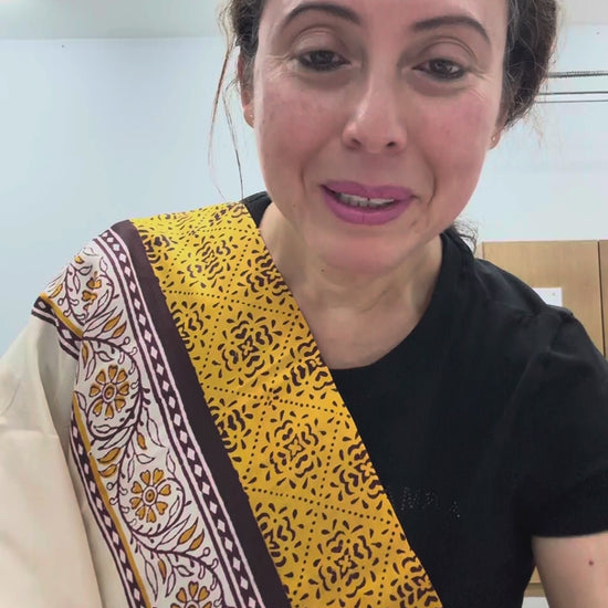 Video of cream and mustard yellow hand block printed 3-ply Murshidabad pure silk saree.