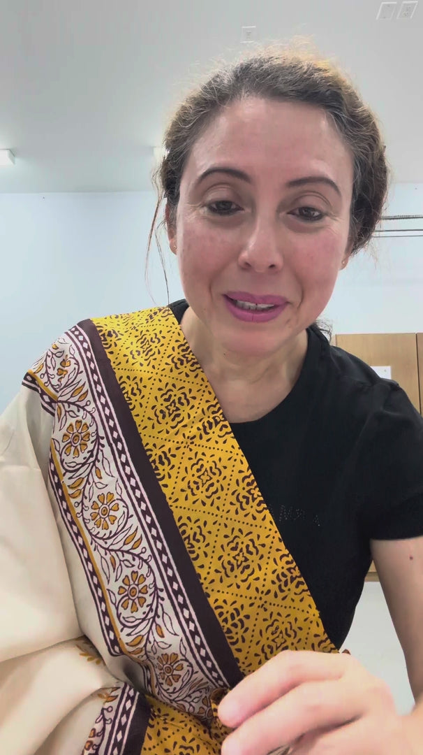 Video of cream and mustard yellow hand block printed 3-ply Murshidabad pure silk saree.
