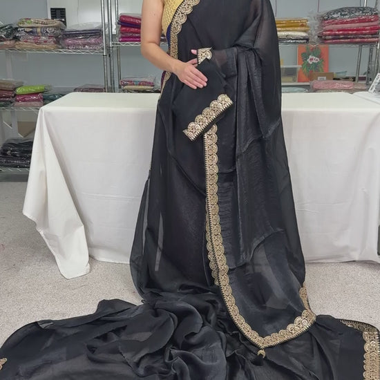 video of product Farah - Designer Glass Tissue Black Partywear Saree with Patched Gold Border from Saree Mandi saree store.