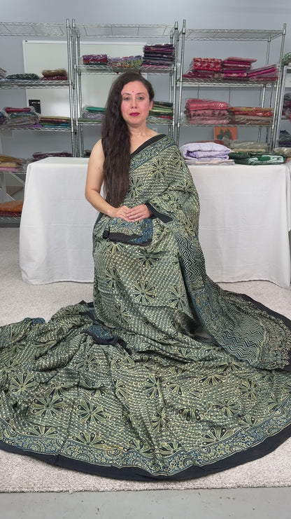 Video of Ajrakh Modal Silk Saree with an Unique Floral Print.