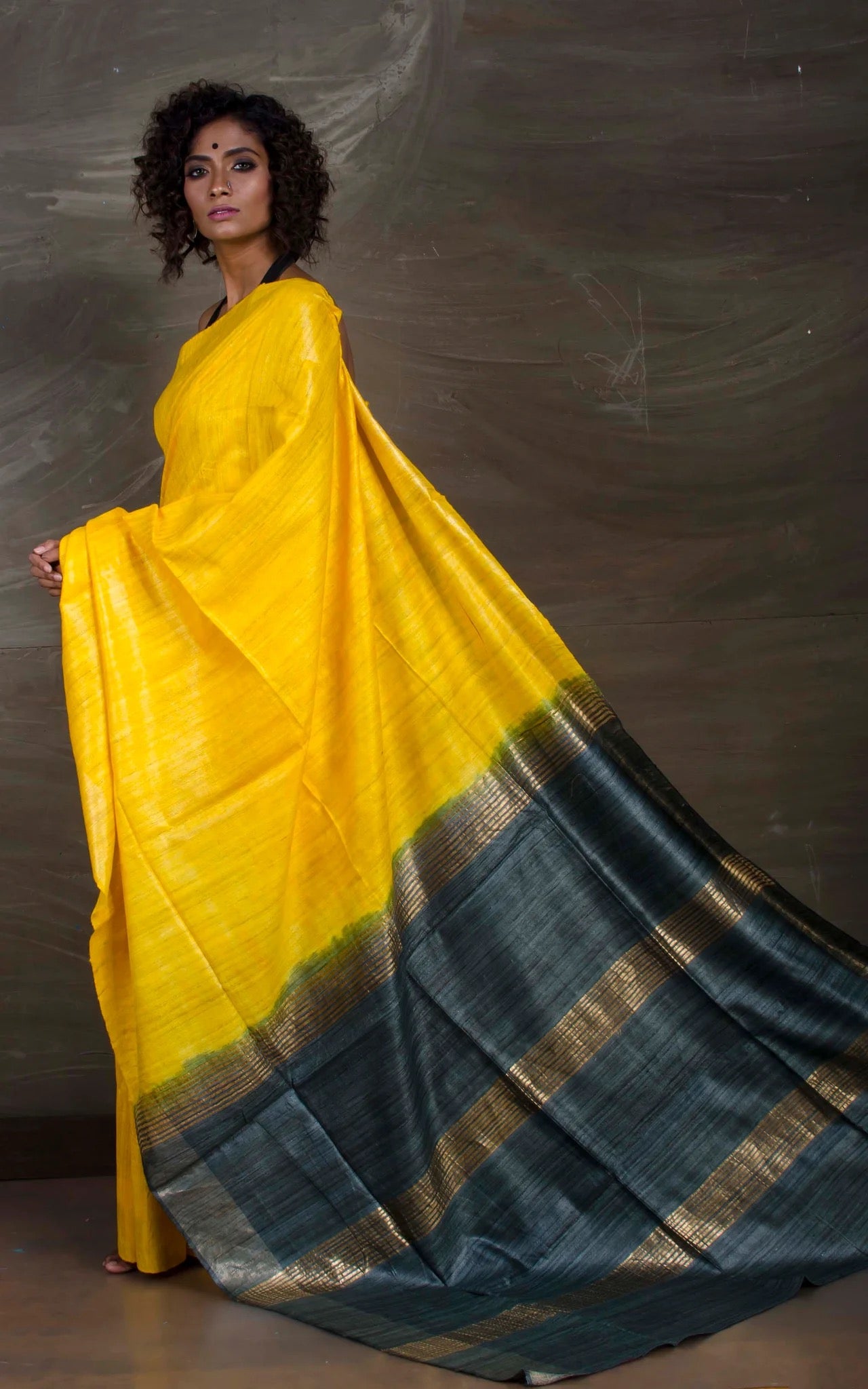 Handloom Gicha Tussar Saree in Yellow and Metallic Grey.