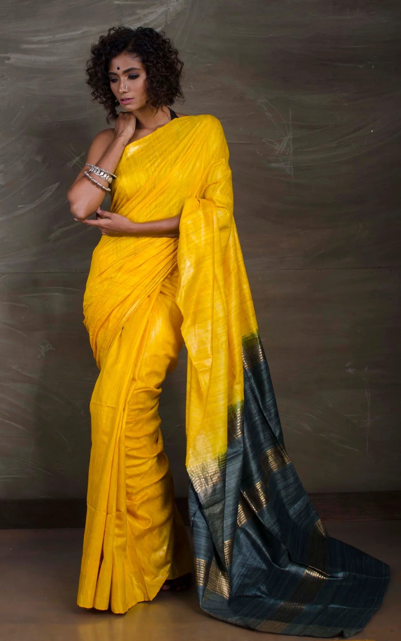 Handloom Gicha Tussar Saree in Yellow and Metallic Grey.